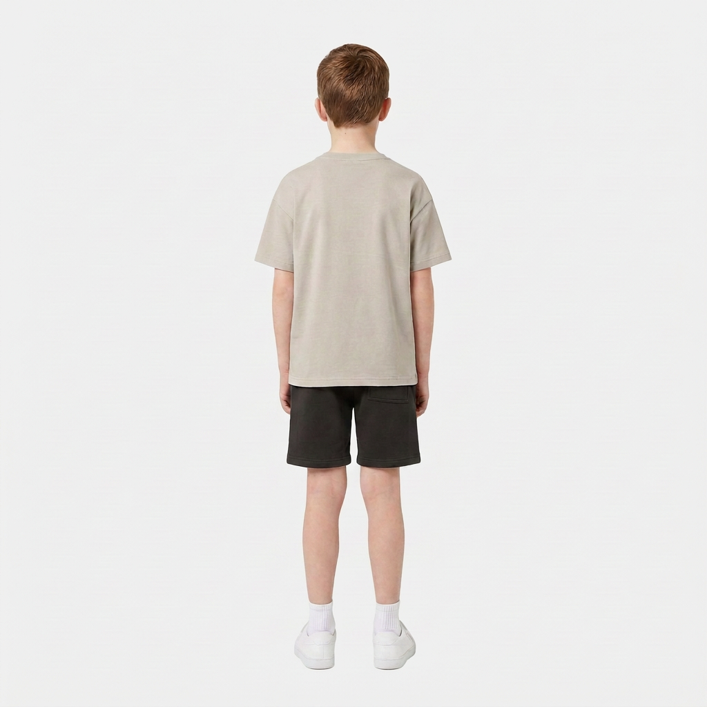Boy wearing the INSPORT kids Scuba tee in stone, back view