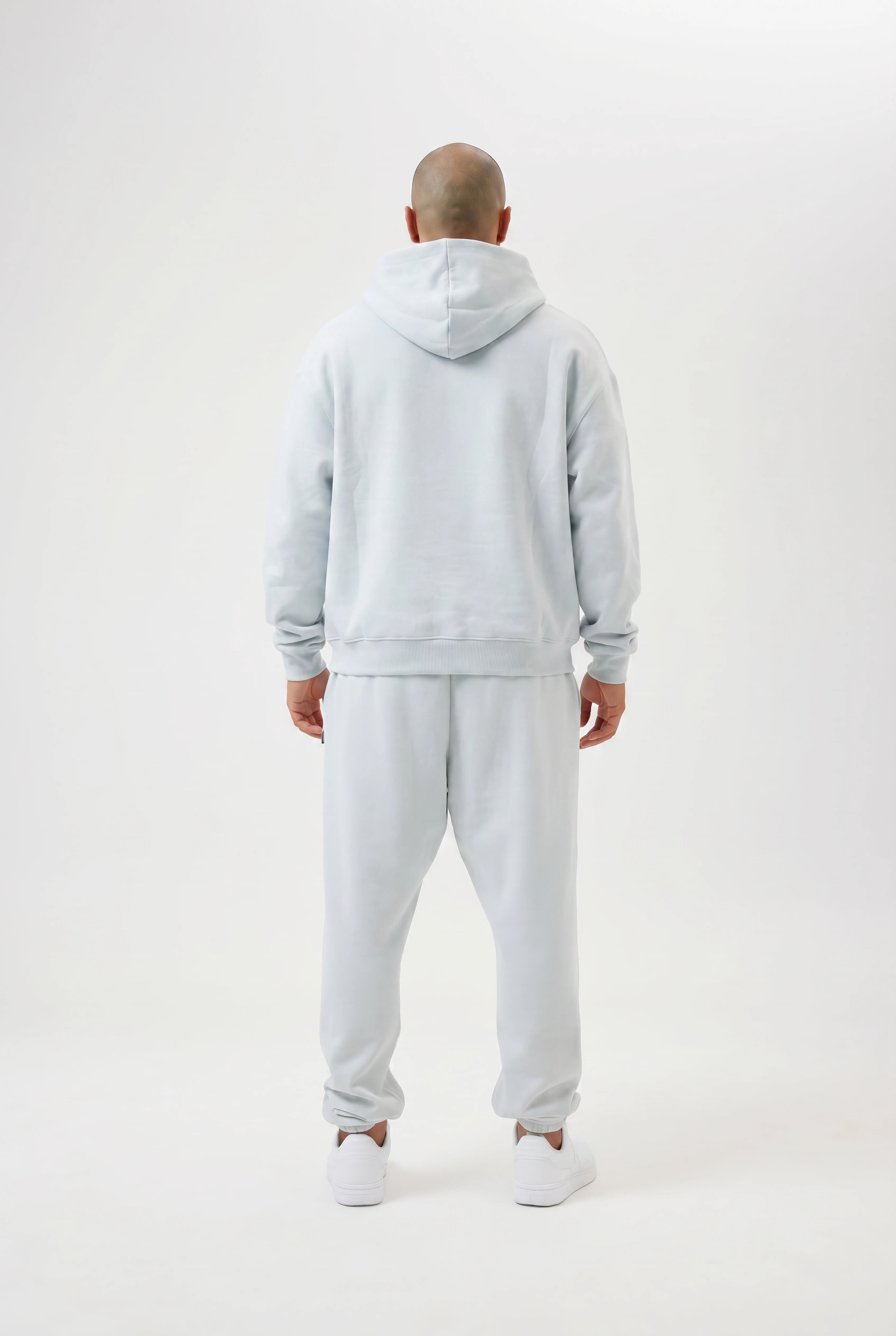 man wearing light blue tracksuit