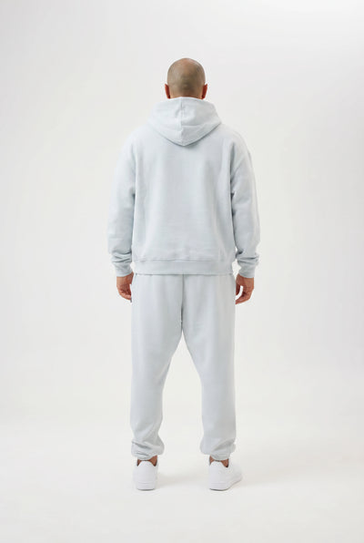 man wearing light blue tracksuit