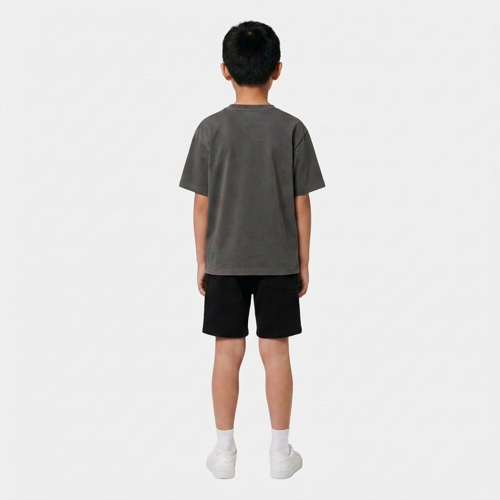 Boy wearing the INSPORT kids Scuba short in black, back view