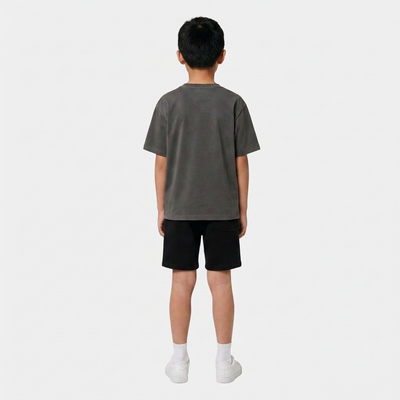 Boy wearing the INSPORT kids Scuba tee in charcoal, back view