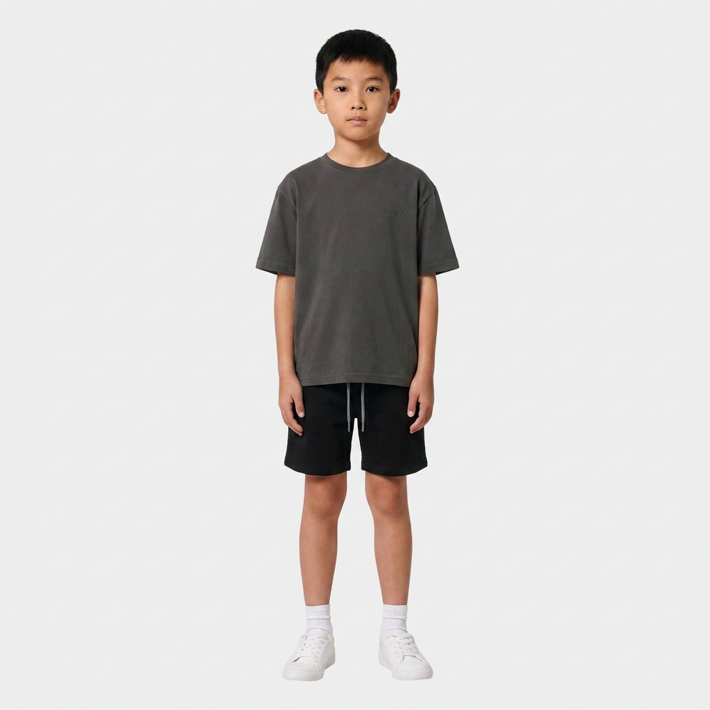 Boy wearing the INSPORT kids Scuba tee in charcoal, front view