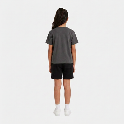 Girl wearing the INSPORT kids Scuba tee in charcoal, back view