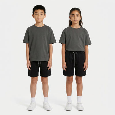 Boy and girl wearing the INSPORT kids Scuba tee in charcoal with black Scuba shorts