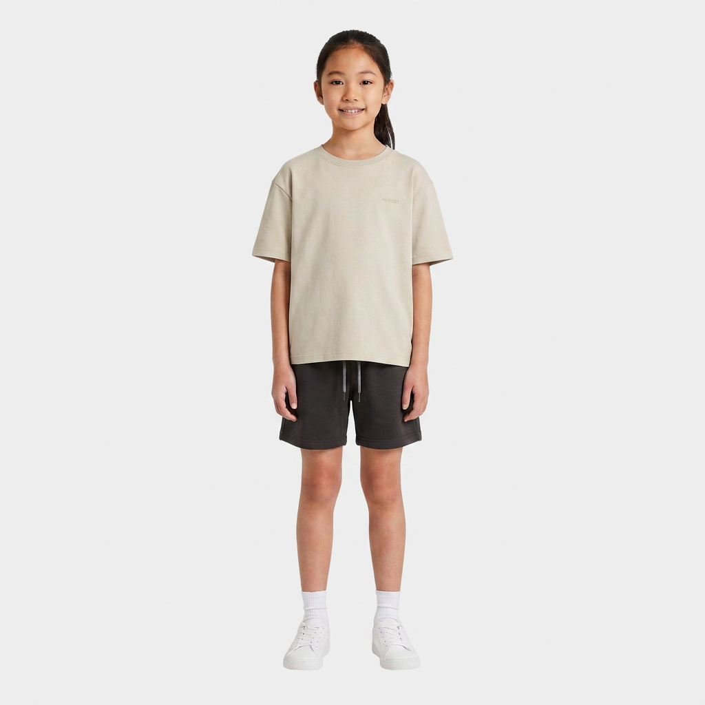 Girl wearing the INSPORT kids Scuba tee in stone, front view