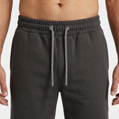 Close-up of the elasticated waistband and drawcord on the charcoal Scuba short