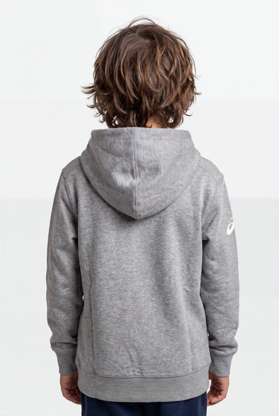 A child viewed from behind wearing a heather gray hooded sweatshirt with a small white Asics logo on the left sleeve, set against a plain light gray studio background.