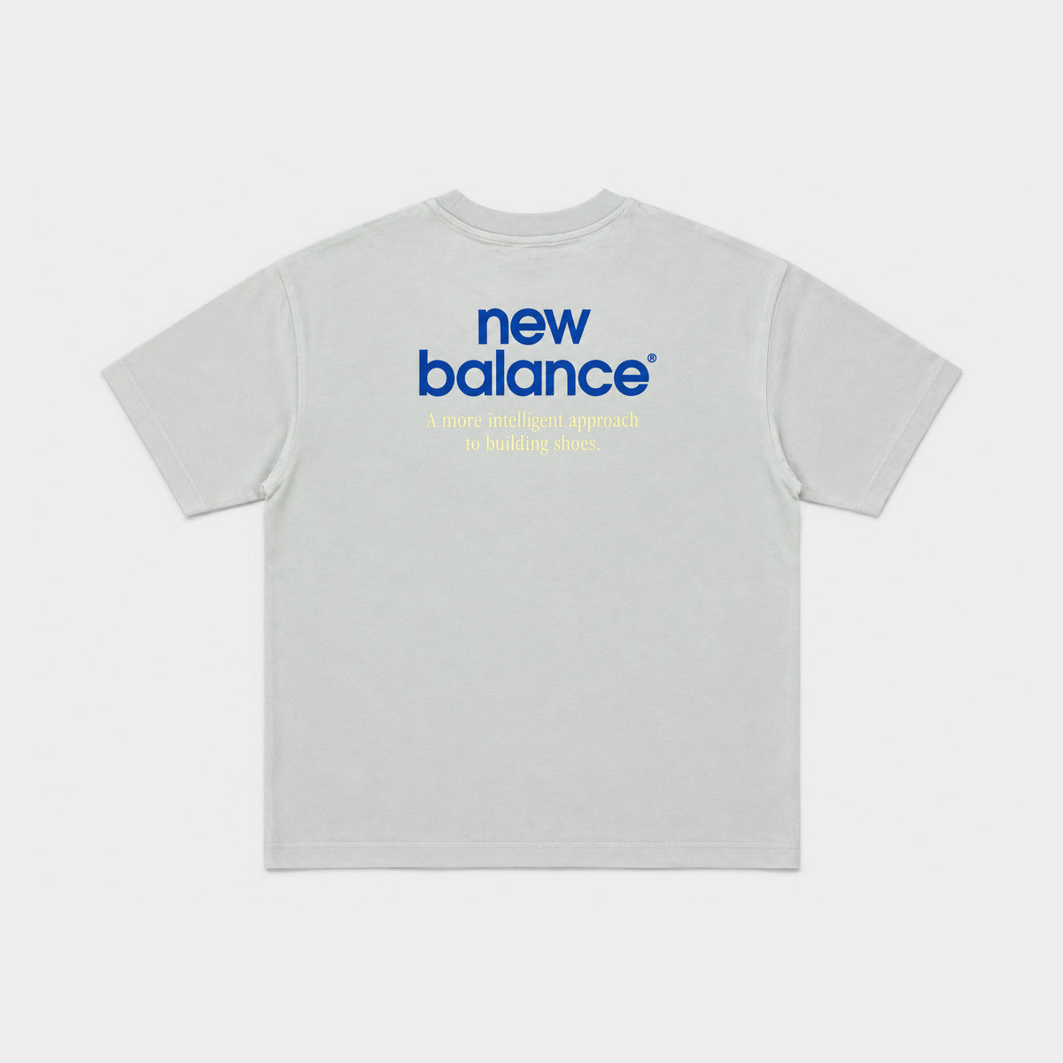 New Balance Men's Intelligent Tee in moss, back flat lay showing the back print