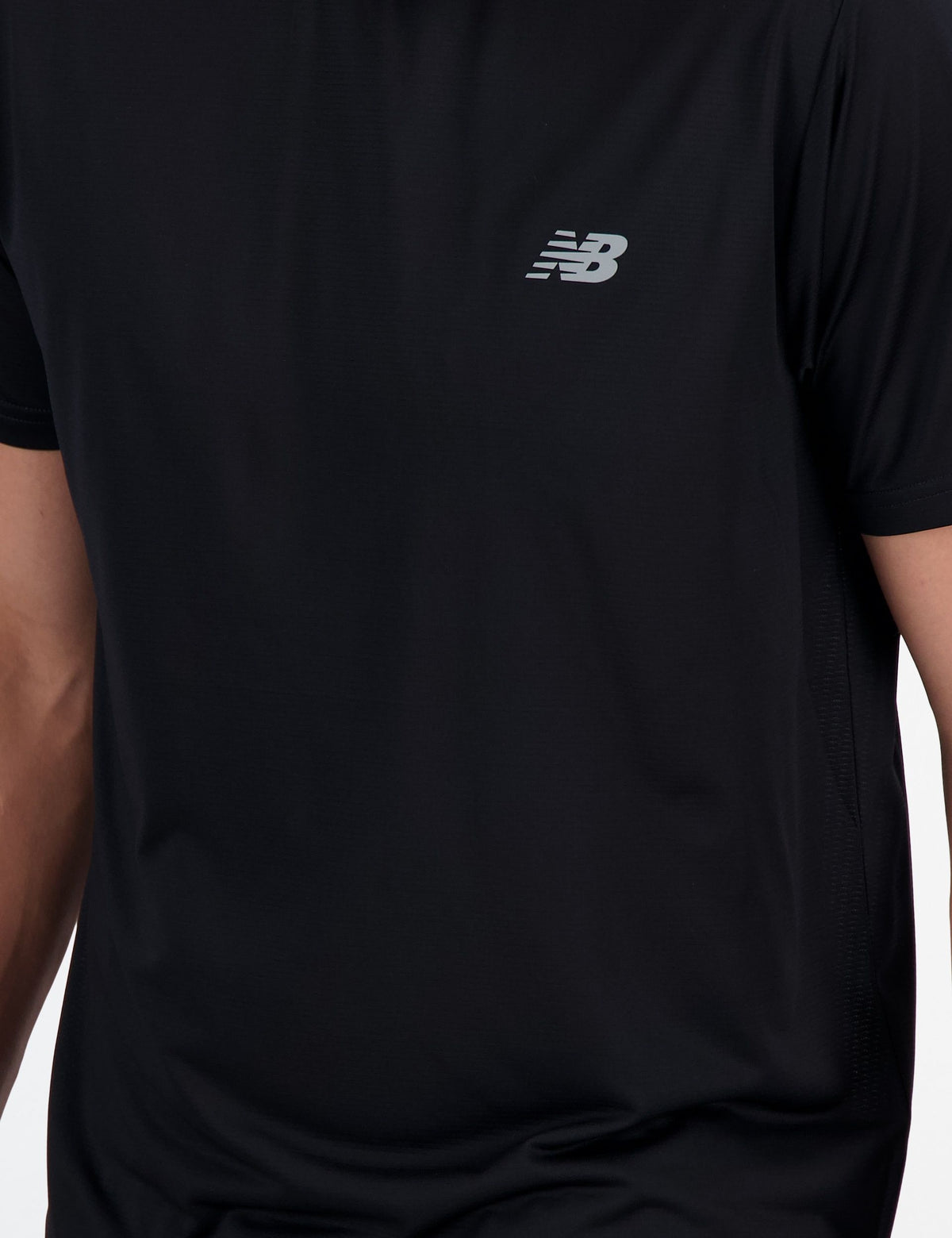 New Balance Sport Essentials Tee in Black – reflective logo detail